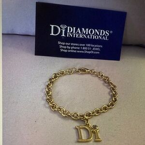 Chic Gold Bracelet with Di Initial Charm with a real diamond. 2 are available.
